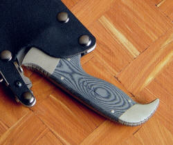 "Hooded Warrior" handle engraving detail. Sniper's symbol is machine engraved into micarta handle