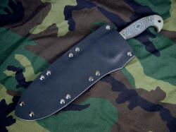"Horrocks" custom tactical combat knife, sheathed view. Sheath is tension fit, deep and protective, yet allows easy handle grab.