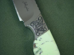 Izanami knife: obverse side front bolster engraving detail.