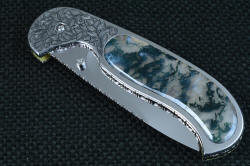 "Izar" linerlock folding knife, obverse side view, folded. Knife is strong, compact, and beautiful, mirror polished thorughout