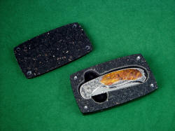 "Izar" folding knife, in black galaxy granite case. Stainless steel pins align and secure top in hand-carved granite