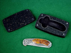 "Izar" and case. Case is granite, carved and inlayed with black suede leather for safe keeping of the knife