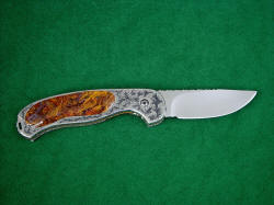 "Izar" liner lock folding knife, reverse side view. The knife is fully embellished, with full filework throughout and hand-engraving on the stainless steel liners