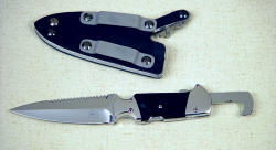 "The Kid" obverse side with hook blade extended. The blade is locked in both open and closed positions, and is dull at the point with a sharpened interior concave grind