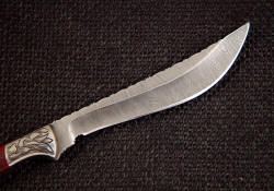 "Kineau" reverse side knife blade detail. Light etching in stainless steel damascus brings out pattern