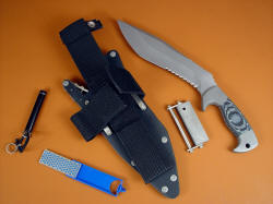 "Kneph" sheath accessory view. Accessories include diamond pad sharpener, magnesium/firesteel fire starter, Maglite solitaire flashlight with all stainles steel fittings