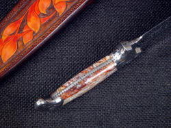 "Kotori" inside handle tang detail. The bolsters are contoured and finely finished, blended to the gemstone scales which are very hard and durable