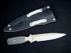 "Lynx" CSAR tactical knife, reverse side view. Double edged knife has tough tactical combat sheath with aluminum belt loops