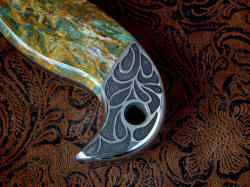 "Macha Navigator EL" obverse side rear bolster engraving detail. Engraving is deep and bold, all cut by hand. Lanyard hole is through tang, chamfered and polished for smoothness 