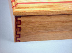 "Macha Navigator" case joinery detail. Double dovetail in Red Oak and Redheart exotic hardwood