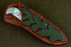 "Menkar" sheathed view. Sheath has high back, allows easy access to knife  handle at the rear quillon, features very nice inlays of green rayskin in color progression hand-dyed leather