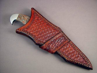 "Mercury Magnum" sheathed view. Knife rides deep in sheath for protection of wearer, can be easily pulled with rear hawk's bill quillon, crossdraw sheath sits angled on belt, left side
