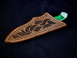 "Nekkar" sheathed view. Sheath is simple and clean, with hand carving and shadowed relief, highlighted with antique stain