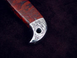 "PJLT Dragon" obverse side rear bolster engraving detail. Engraved design matches main engraving on blade