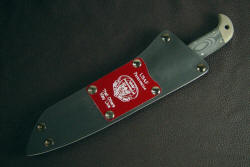 USAF Pararescue knife, sheathed view. Note removable engraved lacquered aluminum flashplate