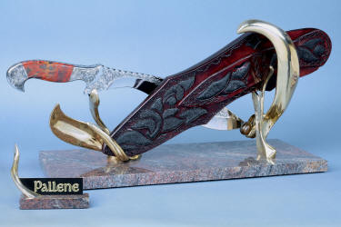 "Pallene" khukri, obverse side view in CPM154CM High molybdenum powder metal technology stainless tool steel blade, hand engraved, with hand-engraved 304 stainless steel bolsters, Brecciated Jasper gemstone  handle, hand-carved leather sheath inlaid with rayskin, hand-cast silicon bronze and Imbuya hardwood stand and Paradiso Classico Granite base