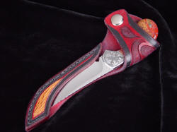"Pecos II" sheathed view. Display/Open sheath protects the point and cutting edge while displaying knife form, handle, bolster details and accents. Knife is secure with flap snap retention