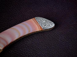 "Procyon" obverse side rear bolster detail. Brazilian agate gemstone handle scales are locked and bedded under bolsters for strength and rigidity