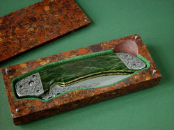 "Procyon" in case. Case is lined with green suede leather to protect knife. Finger cut allows easy removal from case