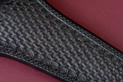 "Raijin" leather sheath front detail. Hand-stamp tooling is traditional black basketweave, surface is buffed and sealed with acrylic satin finish.