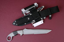 "Raijin" reverse side view. Sheath has ultimate belt loop extender, allowing a lower, more traditional positon for sheath, while carrying and mounting useful accessories: sharpening pad, fireblock, backup LED lamp