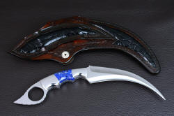 "Raptor" karambit, reverse side view. Sheath back has large panel inlays of black glazed Caiman skin