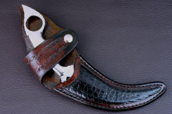 "Raptor" sheathed view. Sheath is deep and protective, with Caimen skin inlay, and flap concealing striking gemstone h andle