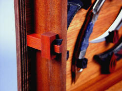 "Raptors" case closure detail. Mahogany case cover is secured with ebony tension wedge in mortised and tenoned joinery