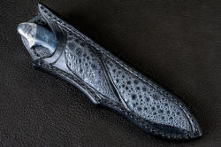 "Regulus" sheathed view. Sheath matches handle and blade well in gray frogskin inlays in hand-carved leather
