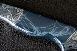 "Regulus" obverse side gemstone handle scale detail. Spiderweb obsidian is all solid, the veins are color only and the material is glassy and polished