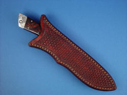 "Rio Grande" sheathed view. Sheath  is deep, protective, displays owner's brand on rear bolster