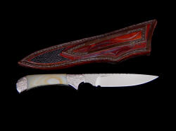 "Ruidoso" reverse side view. Sheath has carving, inlay of stingray skin on back, is thick and strong, stitched with black Nylon thread