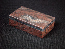 "Sadr" Granite display, presentation, storage case. Note band of gray/black labradorite porphyry granite 