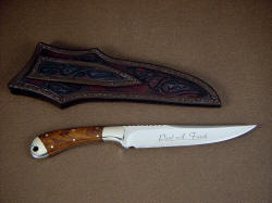 "Sanchez" fine custom knife, reverse side view. Note custom name etching on blade, and hand carving and tooling on sheath back and belt loop