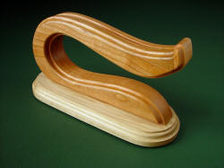 Stand for "Saussure" is self-draining, in Cherry Hardwood upper holder and solid Pecan base for stability. 