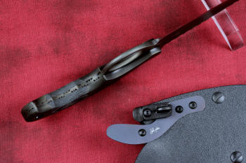 "Skeg"  tactical, counterterrorism, crossover knife, inside tang detail view in ATS-34 high molybdenum martensitic stainless steel blade, 304 stainless steel bolsters, black and gray G10 fiberglass/epoxy composite handle, hybrid tension tab-locking sheath in kydex, anodized aluminum, black oxide stainless steel and anodized titanium
