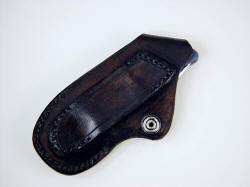 "Stratos" rear view of sheath. Sheath has full belt loop, nickel plated steel retaining snap in 6 oz. leather shoulder