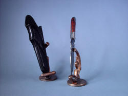"Tharsis Intense" on bronze cast stands, left side view, display is 360 degrees