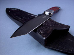"Tharsis Intense" point detail. Knife point is angular, sharp, hollow ground and mirror polished hot blued O1 tool steel