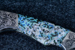 "Thuban" obverse side gemstone handle 4 power enlargement. The crystals of white quartz, blue and black shattuckite, and green malachite are striking in this gem.