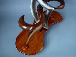 "Tribal" knife sculptural stand is made of hand-carved hardwoods, oiled and varnished for longevity and stability