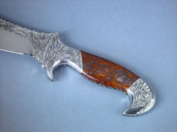 "Tribal" Helhor, obverse side handle view. Engraving is complete through knife and fittings, all stainless steel and gemstone. Handle is contoured, smoothed, and comfortable
