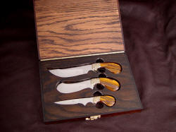 "Trophy Game Set" case view. Note finger cutouts to retrieve knives; case is lined with deerskin