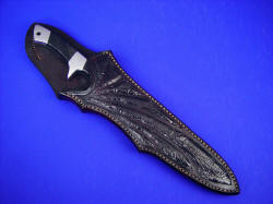 "Vespula" sheathed view. Note finger cutout in sheath mouth to accommodate finger for smooth and easy withdrawl from sheath. The black cherry sheath color compliments the jade nicely