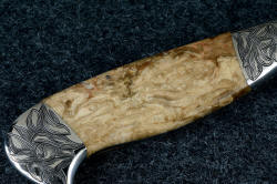 "Vulpecula" reverse side gemstone handle detail. Note curious growth rings in petrified wood with numerous worm holes filled with agate and chalcedony