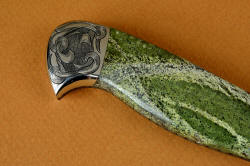 "Vulpecula" reverse side rear bolster engraving detail. Flowing deep relief pattern echoes the lines in the gemstone