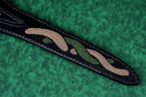 "Wisp" fine handmade fillet knife sheath back tail detail  in T3 deep cryogenically treated CPM 154CM high molybdenum powder metal technology martensitic stainless steel blade, 304 stainless steel bolsters, Willow Creek Jasper gemstone handle, hand-carved leather sheath inlaid with green, tan ray skin