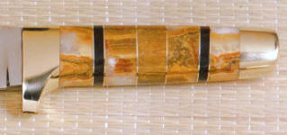 Rhodochrosite gemstone on hidden tang knife handle with African Blackwood and Brass fittings