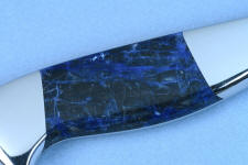 Sodalite gemstone from Brazil, with light reflector above