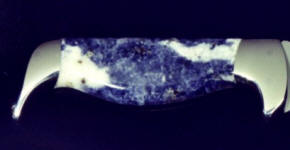 Sodalite is a component in the rock lapis, but is not lapis and has more inclusions of calcite